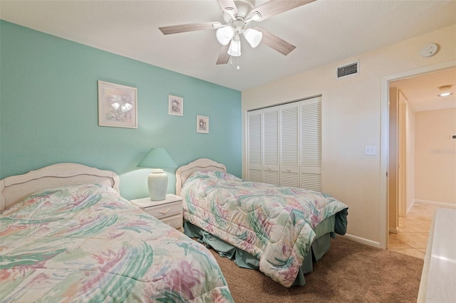 6105 Bahia Del Mar Cir Unit 683, Saint Petersburg, FL 33715 - carpeted bedroom with a closet, a ceiling fan, and baseboards