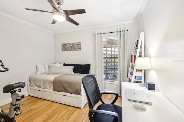 2969 Bonaventure Cir Unit 104, Palm Harbor, FL 34684 - bedroom with light wood finished floors, crown molding, an office area, ceiling fan, and baseboards