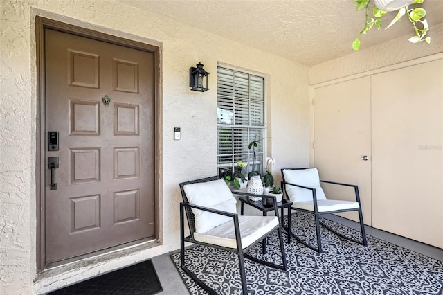 2969 Bonaventure Cir Unit 104, Palm Harbor, FL 34684 - entrance to property featuring stucco siding and a porch