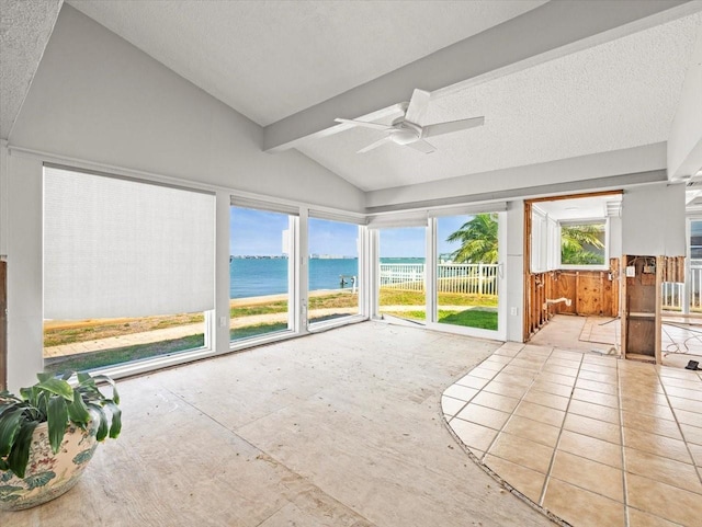 unfurnished sunroom featuring a water view