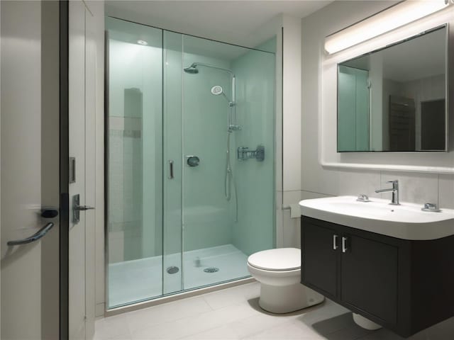 bathroom with a stall shower, vanity, and toilet