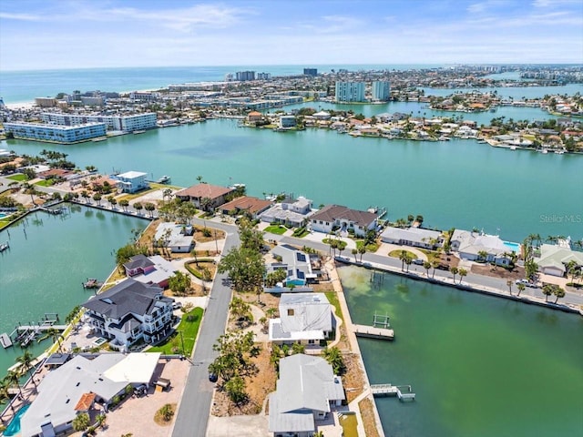aerial view of residential area with a nearby body of water
