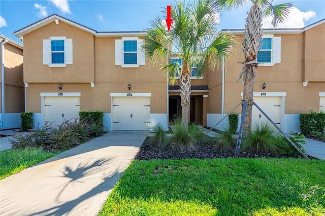 17847 Althea Blue Pl, Lutz, FL 33558 - view of property featuring stucco siding, a garage, and concrete driveway