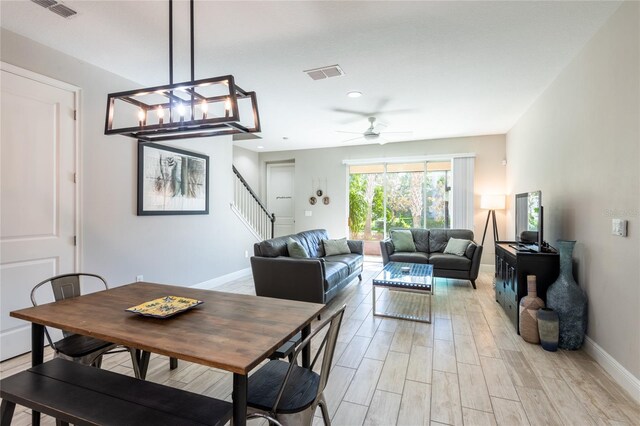 17847 Althea Blue Pl, Lutz, FL 33558 - dining area with stairs, baseboards, light wood finished floors, ceiling fan, and recessed lighting