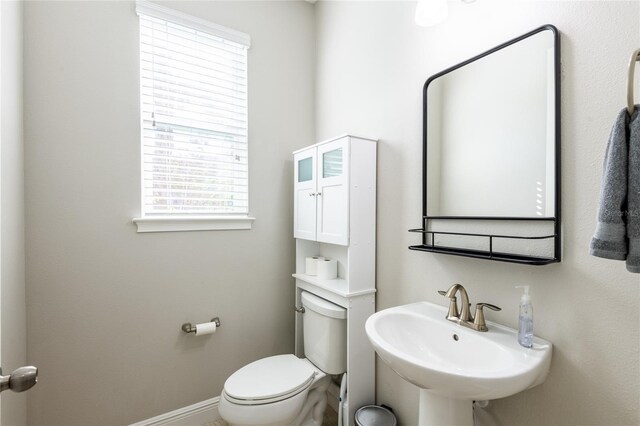 17847 Althea Blue Pl, Lutz, FL 33558 - bathroom with a sink, toilet, and baseboards