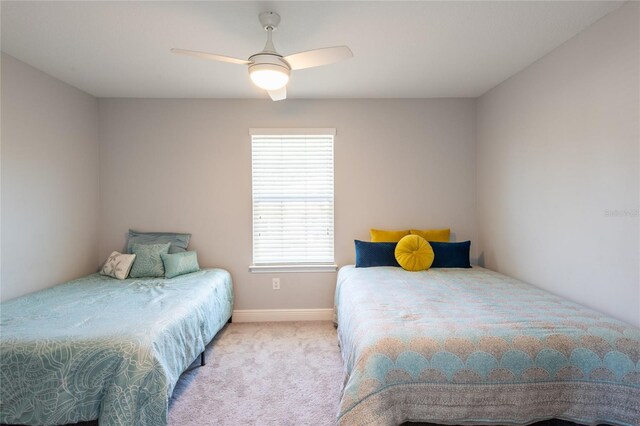 17847 Althea Blue Pl, Lutz, FL 33558 - carpeted bedroom with ceiling fan and baseboards