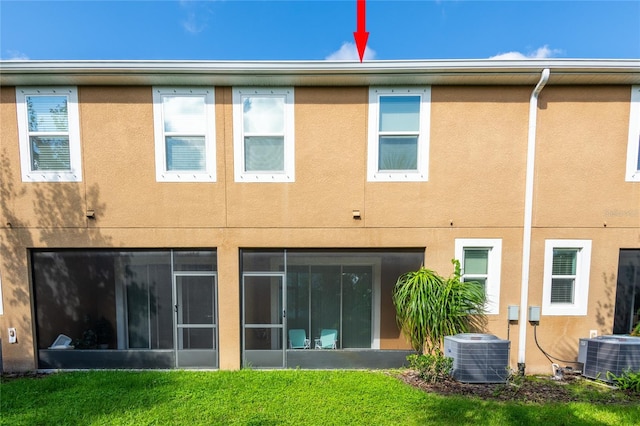 17847 Althea Blue Pl, Lutz, FL 33558 - back of property with central AC unit, stucco siding, and a yard
