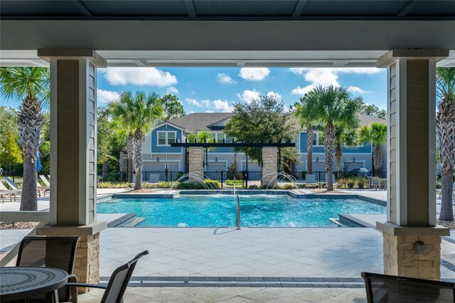 17847 Althea Blue Pl, Lutz, FL 33558 - view of swimming pool with a patio area, fence, and a residential view