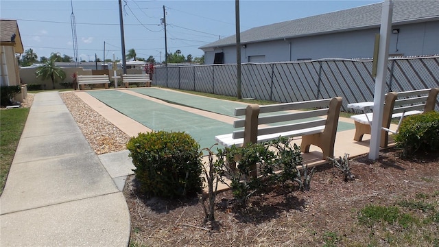 4736 Sunny Loop, Holiday, FL 34690 - view of yard featuring fence and shuffleboard