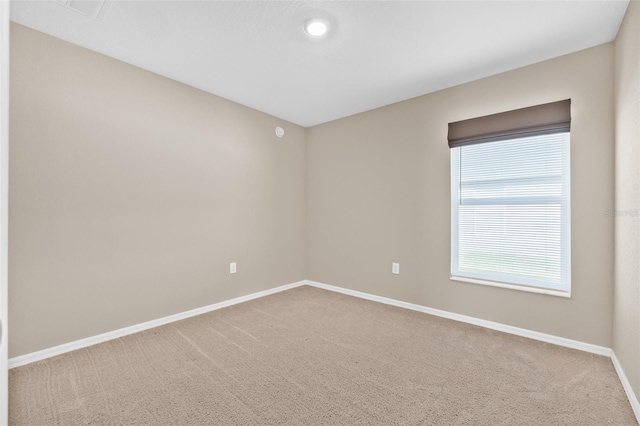 6937 Gideon Cir, Zephyrhills, FL 33541 - carpeted spare room with baseboards