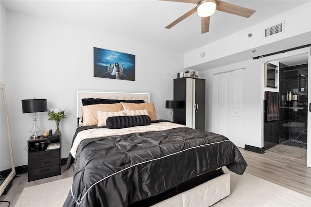 219 4th Ave N Unit 201, Saint Petersburg, FL 33701 - bedroom featuring light wood-style flooring, a ceiling fan, and baseboards