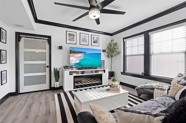 219 4th Ave N Unit 201, Saint Petersburg, FL 33701 - living room with baseboards, wood finished floors, a ceiling fan, ornamental molding, and a textured ceiling