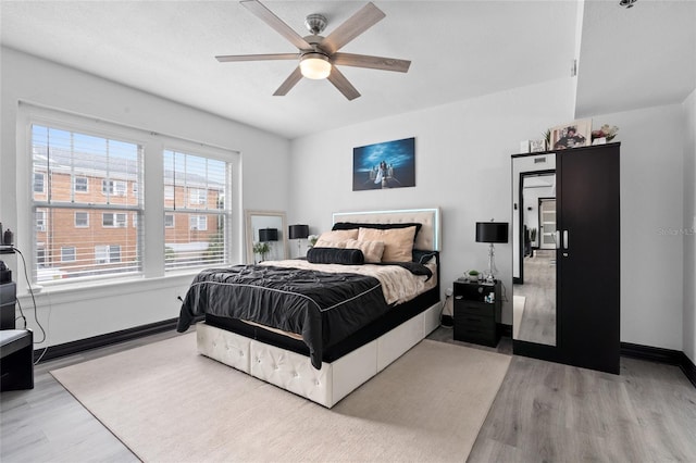 219 4th Ave N Unit 201, Saint Petersburg, FL 33701 - bedroom featuring wood finished floors, baseboards, and a ceiling fan