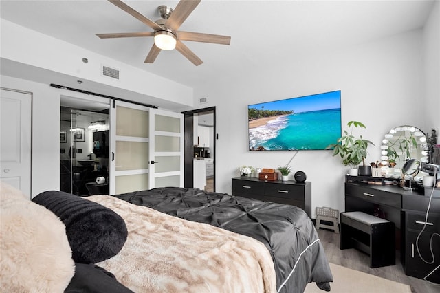 219 4th Ave N Unit 201, Saint Petersburg, FL 33701 - bedroom featuring wood finished floors and a ceiling fan