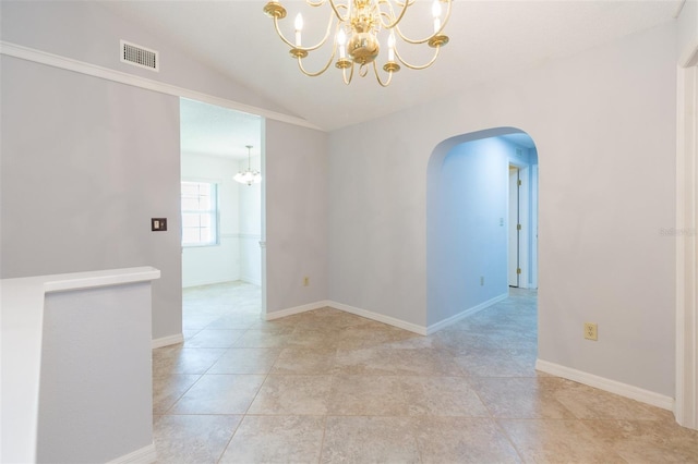 spare room featuring a chandelier, arched walkways, vaulted ceiling, and light tile patterned flooring