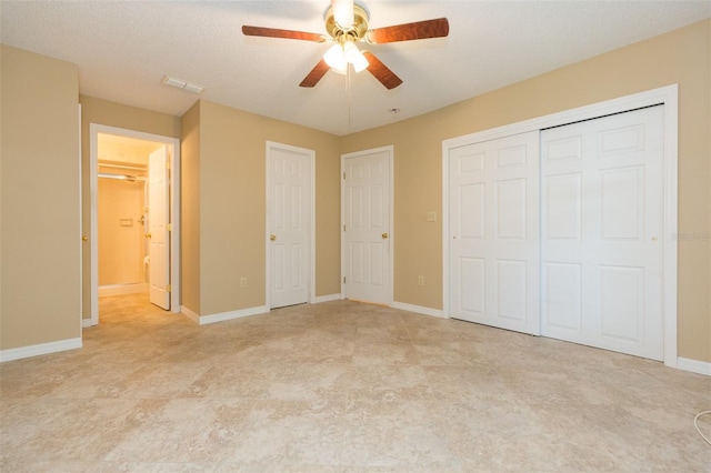 unfurnished bedroom with baseboards, a closet, and ceiling fan
