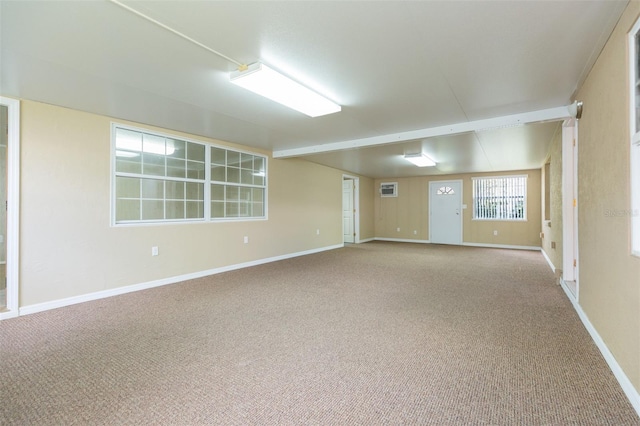 carpeted spare room with baseboards