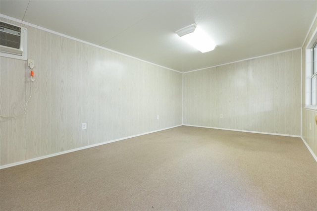 carpeted spare room with a wall unit AC