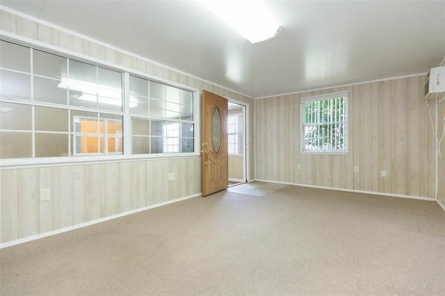 carpeted spare room featuring baseboards