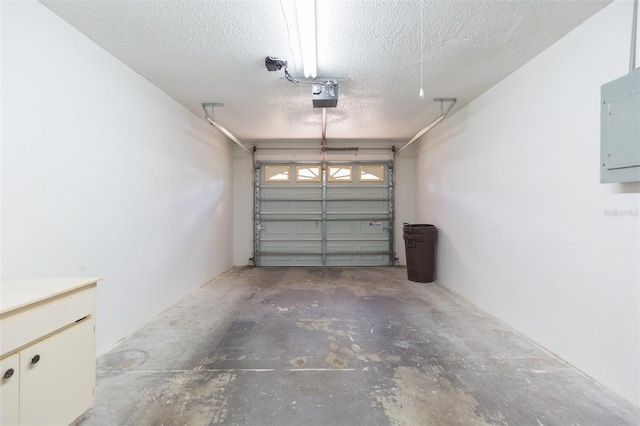 garage featuring a garage door opener and electric panel