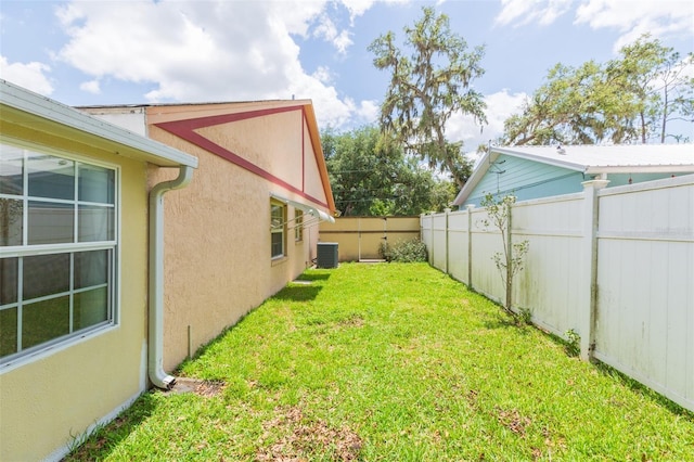 view of yard featuring central AC