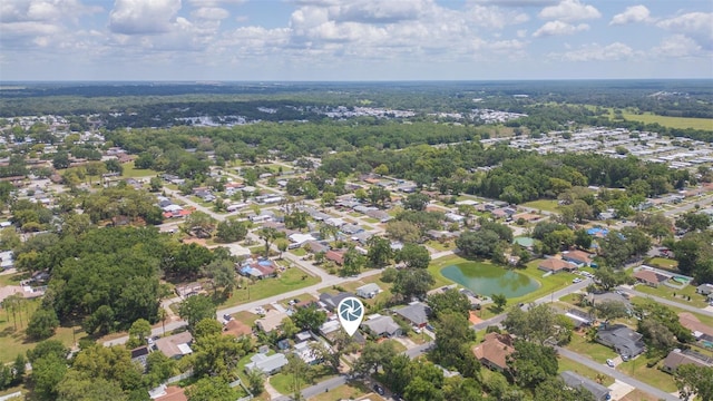 aerial overview of property's location featuring a large body of water and nearby suburban area