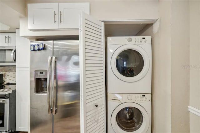 5321 Summerlin Rd Unit 2108, Fort Myers, FL 33919 - laundry room with stacked washer and clothes dryer