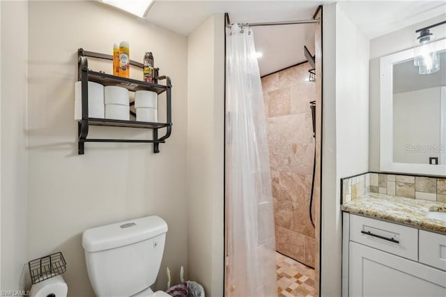5321 Summerlin Rd Unit 2108, Fort Myers, FL 33919 - full bathroom featuring a tile shower, vanity, and toilet
