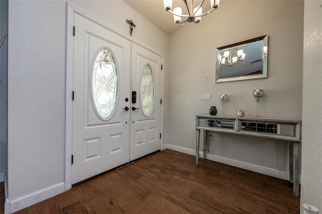 10149 Briar Cir, Hudson, FL 34667 - entrance foyer with a chandelier, dark wood finished floors, and baseboards