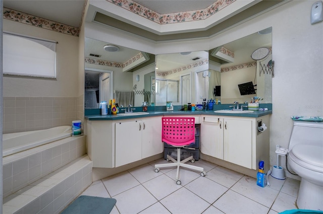 10149 Briar Cir, Hudson, FL 34667 - full bathroom featuring a bath, vanity, a shower stall, toilet, and tile patterned floors