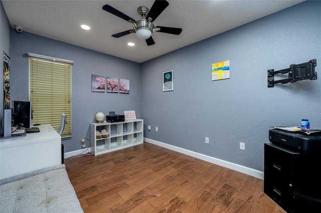 10149 Briar Cir, Hudson, FL 34667 - home office with a ceiling fan, wood finished floors, baseboards, and recessed lighting