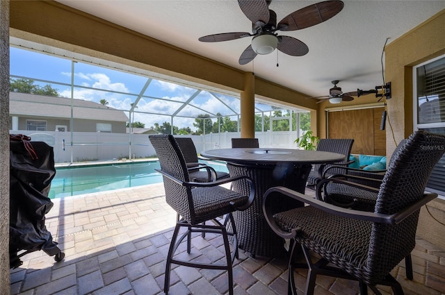 10149 Briar Cir, Hudson, FL 34667 - fenced backyard with ceiling fan, a patio area, glass enclosure, and outdoor dining area