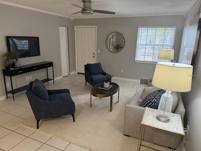 4801 W Mcelroy Ave Unit D104, Tampa, FL 33611 - living area featuring a ceiling fan, crown molding, tile patterned floors, baseboards, and a textured ceiling