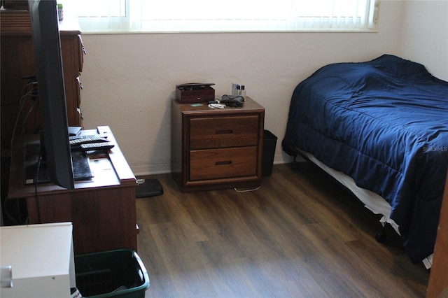2020 World Parkway Blvd Unit 12, Clearwater, FL 33763 - bedroom featuring dark wood-type flooring