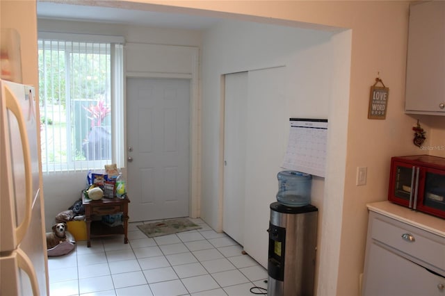2020 World Parkway Blvd Unit 12, Clearwater, FL 33763 - entryway with plenty of natural light and light tile patterned floors
