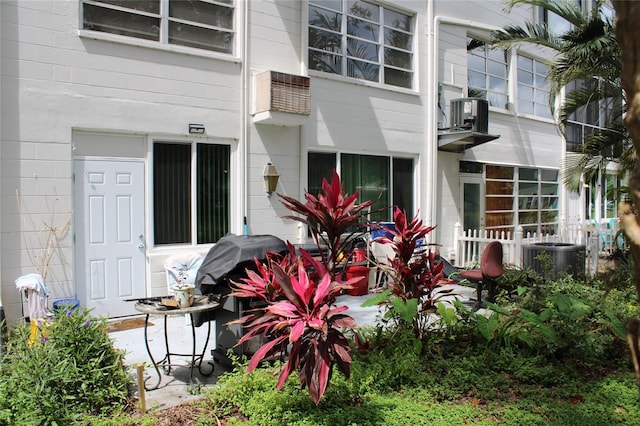 2020 World Parkway Blvd Unit 12, Clearwater, FL 33763 - back of house with cooling unit and concrete block siding