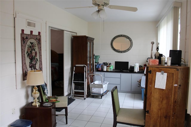 2020 World Parkway Blvd Unit 12, Clearwater, FL 33763 - living room with ceiling fan and light tile patterned floors