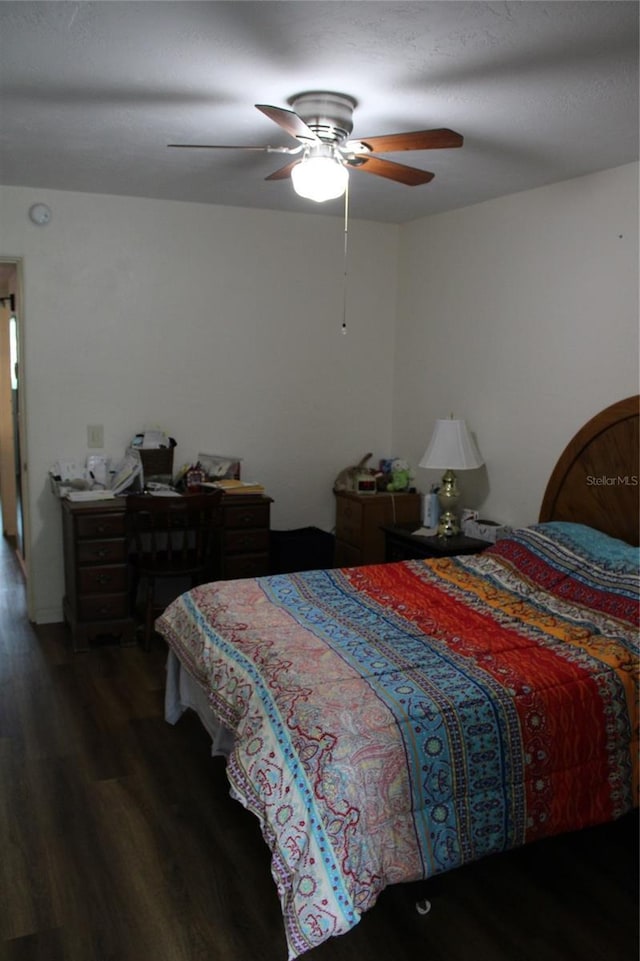 2020 World Parkway Blvd Unit 12, Clearwater, FL 33763 - bedroom with wood finished floors and ceiling fan
