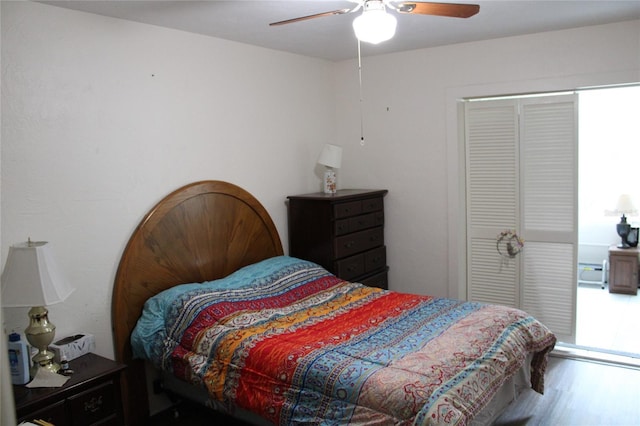 2020 World Parkway Blvd Unit 12, Clearwater, FL 33763 - bedroom featuring wood finished floors and a ceiling fan