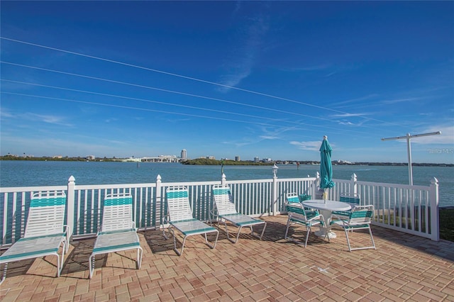 view of patio with a water view