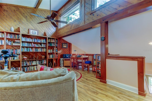 3406 Hollyhock Way, Tampa, FL 33618 - sitting room featuring wooden walls, ceiling fan, wood finished floors, and baseboards