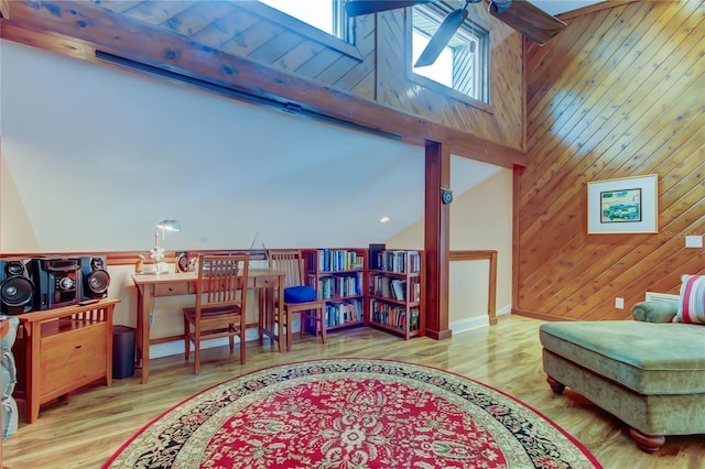 3406 Hollyhock Way, Tampa, FL 33618 - living area featuring ceiling fan, wood finished floors, wooden walls, and lofted ceiling