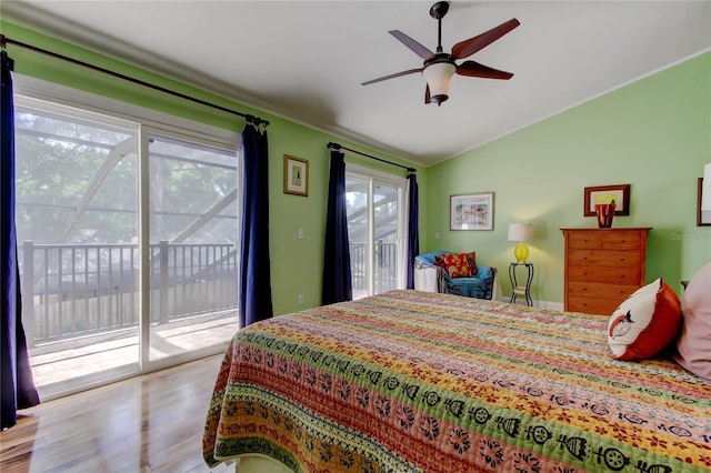 3406 Hollyhock Way, Tampa, FL 33618 - bedroom with access to outside, lofted ceiling, and wood finished floors