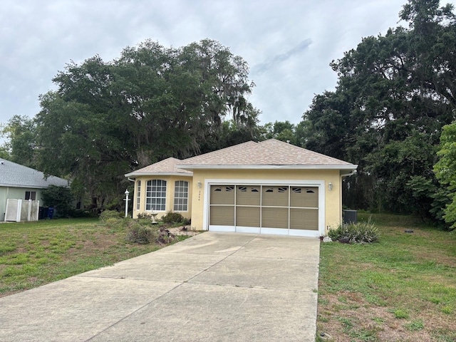 2846 N Kittery Pt, Hernando, FL 34442 - ranch-style house with driveway, a front yard, an attached garage, and stucco siding