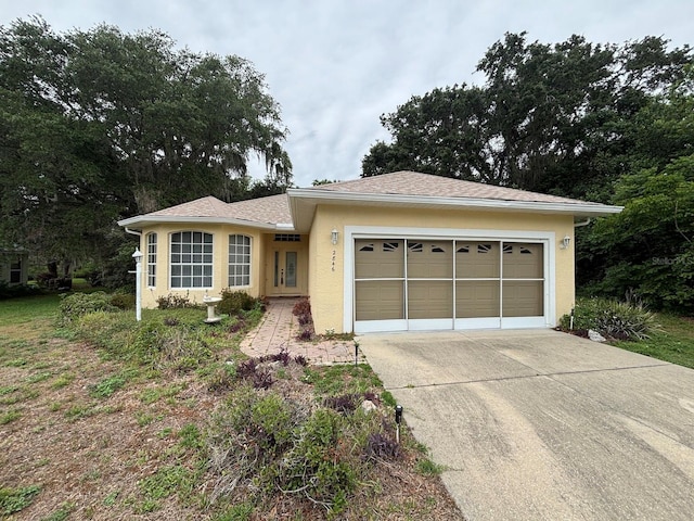 2846 N Kittery Pt, Hernando, FL 34442 - ranch-style house featuring concrete driveway, stucco siding, and a garage