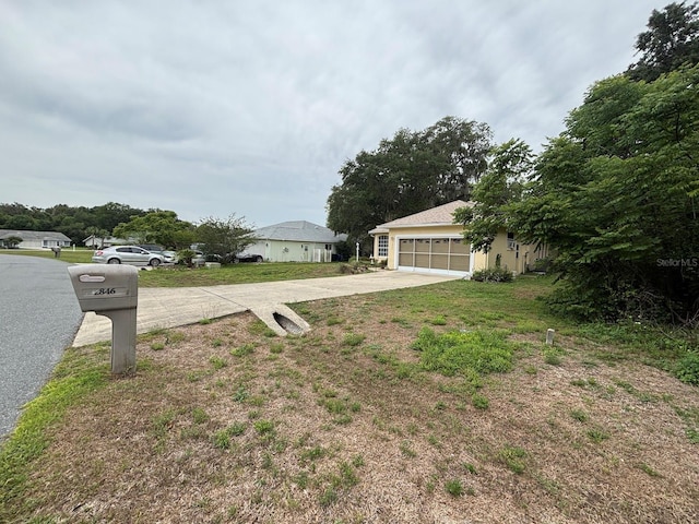 2846 N Kittery Pt, Hernando, FL 34442 - view of yard featuring concrete driveway and an attached garage