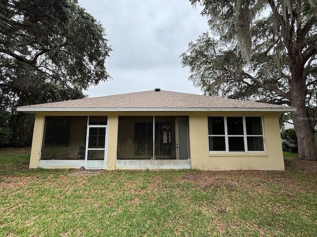 2846 N Kittery Pt, Hernando, FL 34442 - back of house with a sunroom, a yard, stucco siding, and roof with shingles