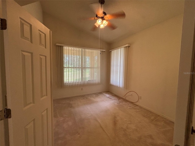 2846 N Kittery Pt, Hernando, FL 34442 - empty room featuring a ceiling fan, baseboards, vaulted ceiling, and carpet floors