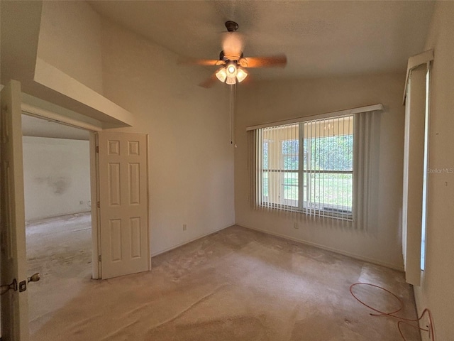 2846 N Kittery Pt, Hernando, FL 34442 - empty room featuring carpet flooring, ceiling fan, and vaulted ceiling