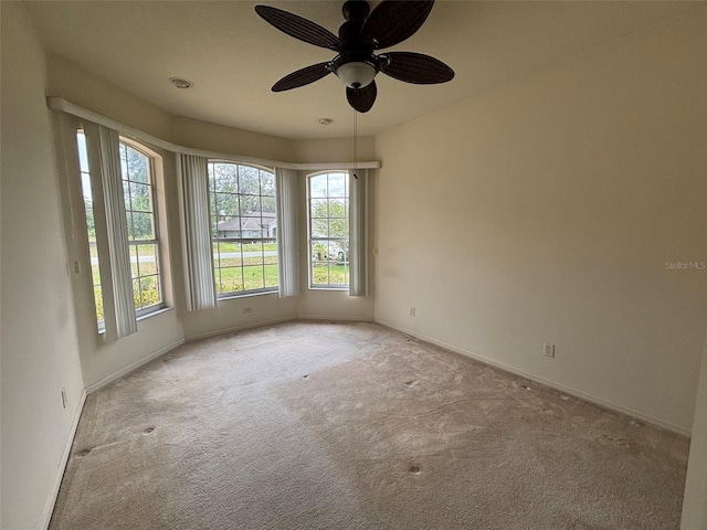 2846 N Kittery Pt, Hernando, FL 34442 - empty room with light colored carpet, baseboards, and ceiling fan
